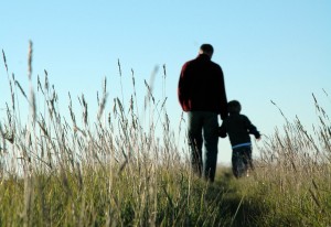 father-son-walking-field